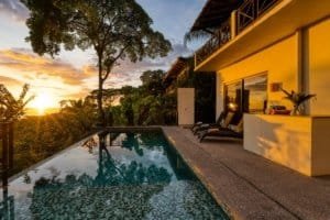Luxury villa with pool, ocean view, and sunset in Dominical, Costa Rica.