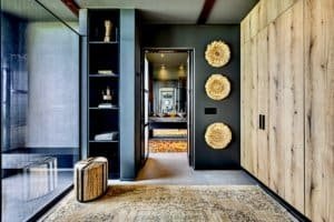 Modern interior with dark walls, decorative wall art, and a mirror in Dominical.