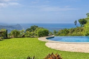 Whitewater ocean view from luxury home with infinity pool and garden.