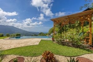 Beautiful garden with pool, gazebo, and ocean view in Dominical, Costa Rica.