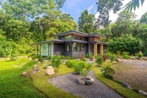 Modern Japanese-style home surrounded by lush tropical jungle in Costa Rica.