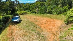 Serene jungle plot with building platforms and mountain views in Dominical, Costa Rica.