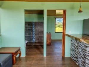 Cozy interior with mountain views, modern decor, and natural light in Dominical.