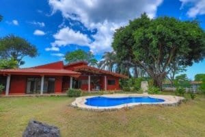 Beautiful hacienda style home with pool and lush garden in Dominical, Costa Rica.