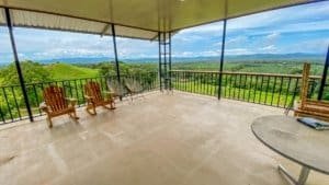 Spacious covered deck with mountain and jungle views in Dominical.