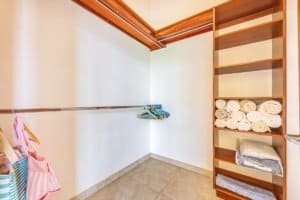Walk-in closet with shelves and hanging space in a luxury property.