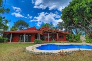 Beautiful hacienda-style home with pool and lush greenery in Dominical.