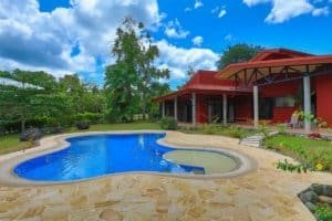 Beautiful hacienda style home with pool, stables, and lush greenery in Dominical.