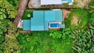 Aerial view of a modern tropical home with a private pool in Dominical, Costa Rica.