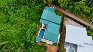 Aerial view of a modern tropical home with private pool in Dominical, Costa Rica.