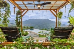 Outdoor deck with infinity pool and mountain view in Dominical.