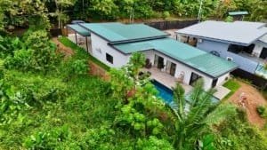 Contemporary tropical house with pool surrounded by lush greenery in Dominical.