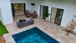 Luxury Costa Rica home with pool, patio, and outdoor seating area.