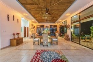 Spacious living room with ocean view, outdoor patio, and elegant decor.