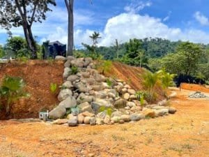 Fenced and gated land with spring concession and ocean view in Dominical, Costa Rica.