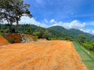 Fenced and gated land with ocean view, ready to build, in Dominical, Costa Rica.