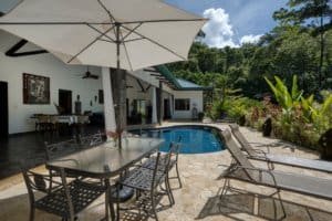 Beautiful Bali style home with pool, outdoor dining, and lush tropical garden in Dominical.
