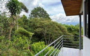 Balcony overlooking lush tropical forest in Dominical, Costa Rica.