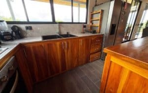 Stylish kitchen with wooden cabinets and mountain views near Dominical.