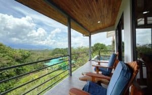 Balcony with mountain views and seating in Dominical, Costa Rica.
