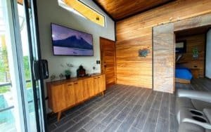 Interior of a mountain view home with wooden walls and modern decor in Dominical.