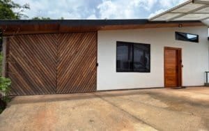 Contemporary Costa Rican house with wooden accents and mountain views.
