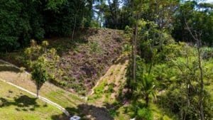 Scenic mountain land with ocean view, dual building sites, and private driveway.