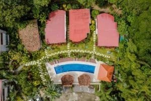 Aerial view of a private villa with pool and lush greenery in Dominical, Costa Rica.