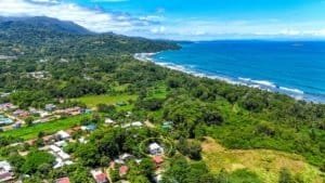 Coastal Costa Rica hillside community with ocean view and lush greenery.