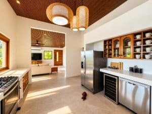 Dominical area kitchen with stainless appliances and open living space.