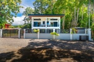 Two-bedroom beach condo with modern balcony and gated entrance in Costa Rica.