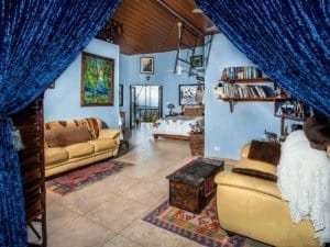 Interior of a Costa Rican home with colorful decor and tropical art.