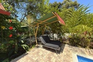 Relaxing outdoor lounge with canopy and lush tropical plants in Dominical.
