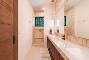 Dominical Costa Rica luxury bathroom with double vanity and tiled walls.