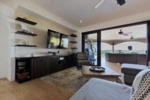 Modern living room with ocean view, TV, and stylish decor in Costa Rica.