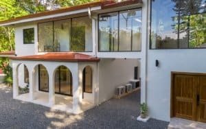 Dominical real estate modern tropical home with private pool and covered patio in Costa Rica.
