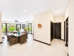 Bright, modern living room with garden view and resort amenities in Dominical.