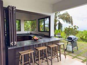 Beautiful ocean view from a luxury home with pool and garden in Dominical.
