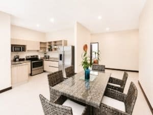 Spacious kitchen and dining area in a Dominical condo with garden view.