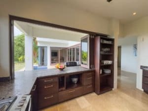 Spacious kitchen with granite countertops and ocean view in Dominical, Costa Rica.
