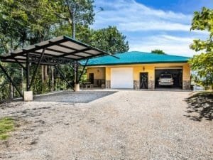 Modern Costa Rica estate with ocean view, pool, and tropical rainforest surroundings.