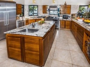 Spacious kitchen with wooden cabinets, granite countertops, and stainless steel appliances.
