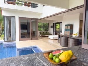Modern Costa Rica home with pool, outdoor seating, and garden view.