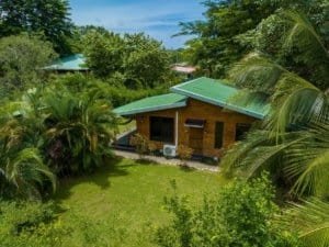 Turn-key 2-bedroom coastal home with green roof surrounded by tropical plants near Dominical.
