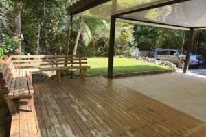 Panoramic ocean-view terrace with wooden deck and seating in Costa Rica.