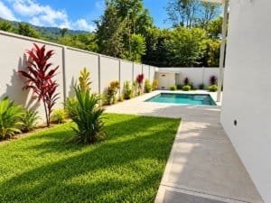Modern 3-bedroom home with private pool in a landscaped yard and fenced courtyard in Dominical Costa.
