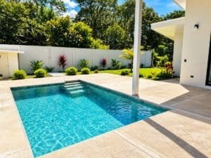 Dominical real estate: modern design home with private pool and landscaped yard.
