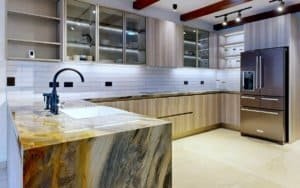 Contemporary kitchen featuring island, granite countertop, white subway backsplash, wood cabinets, a.
