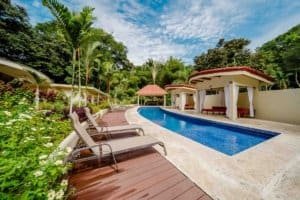 Luxury private villa with pool, lush greenery, and resort amenities in Dominical.