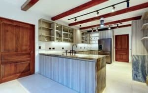 Modern tropical kitchen with wood beams and island, Costa Rica real estate.